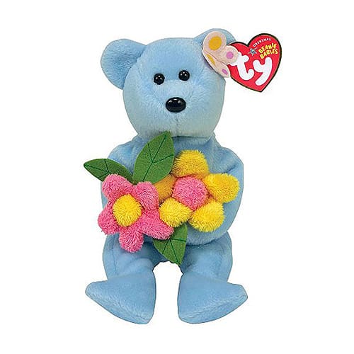 Ty bear carrying flowers