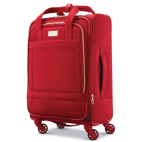 red luggage bag for travellers